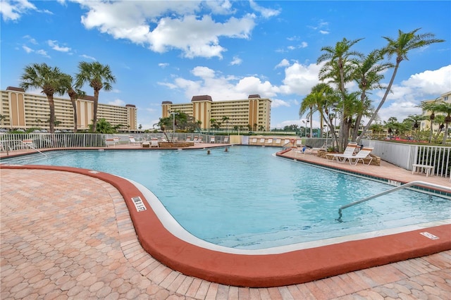 view of swimming pool featuring a patio area