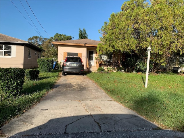 2401 42nd St S, Saint Petersburg, FL 33711 - view of front of house with a front yard and concrete driveway