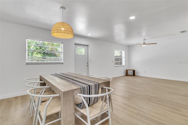 dining area featuring ceiling fan and light hardwood / wood-style flooring