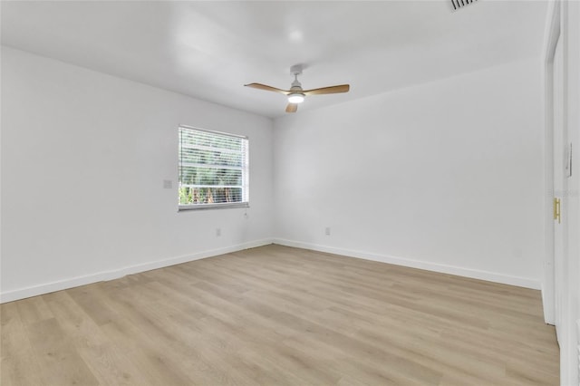 empty room featuring ceiling fan and light wood-type flooring