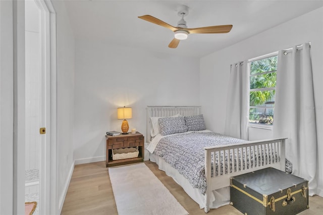 bedroom with wood-type flooring and ceiling fan