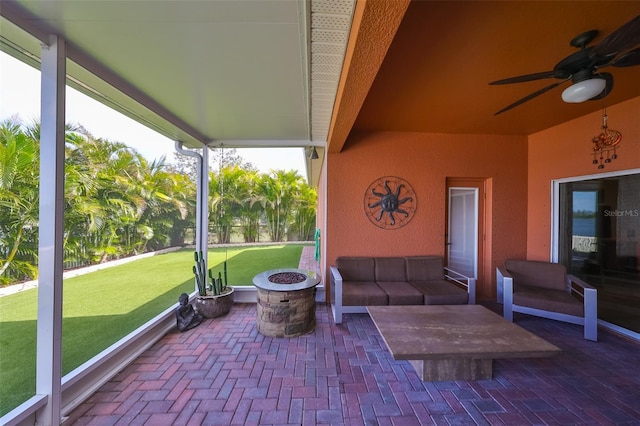 view of patio featuring a fire pit and ceiling fan