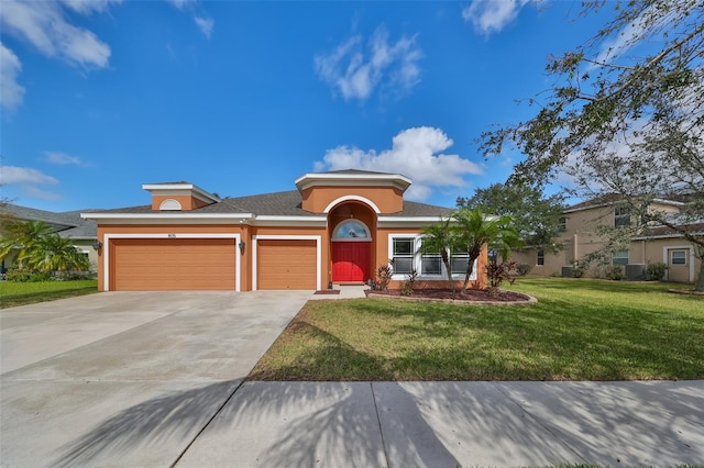 view of front of house featuring a garage and a front yard