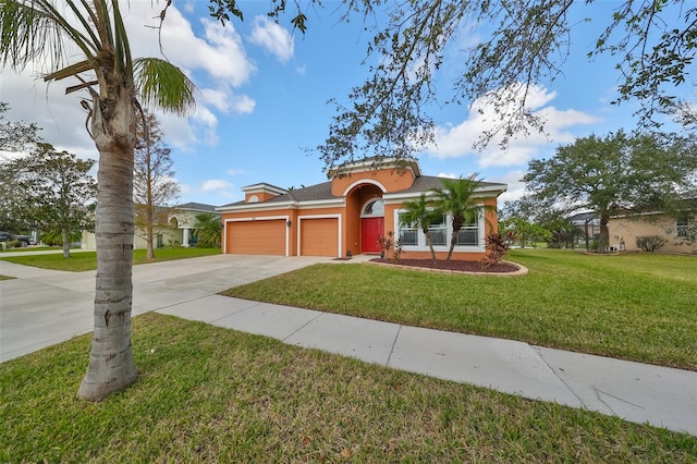 view of front of property with a garage and a front lawn