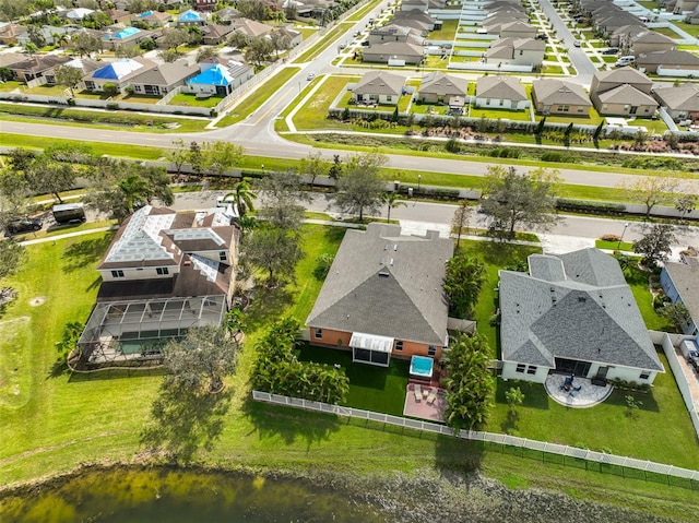 birds eye view of property featuring a water view