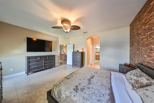 bedroom featuring connected bathroom and ceiling fan