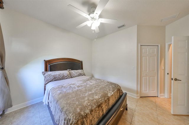 bedroom with light tile patterned floors and ceiling fan