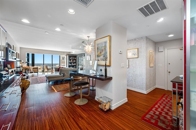 kitchen with an inviting chandelier and hardwood / wood-style floors