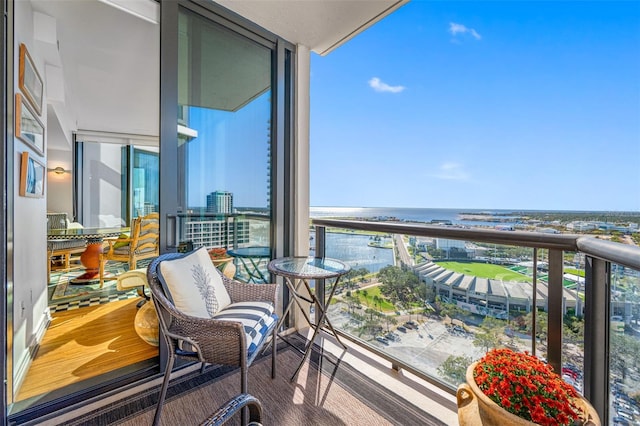 balcony featuring a water view