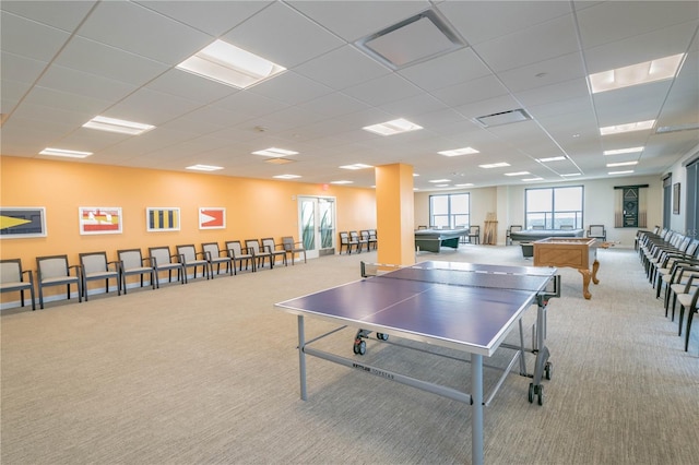 rec room with light carpet, billiards, and a paneled ceiling