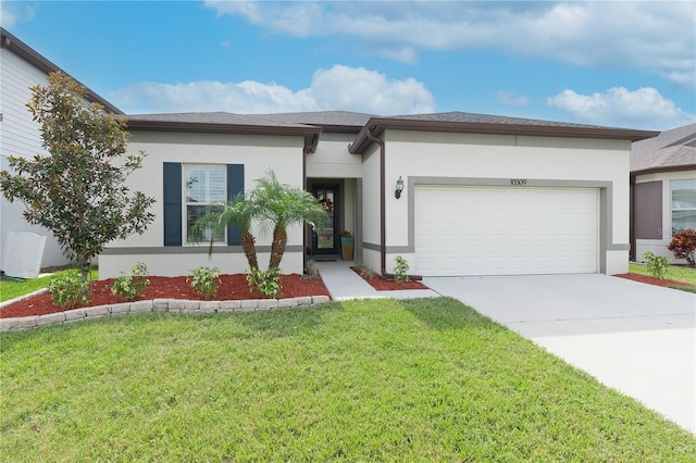 view of front of home featuring a front lawn and a garage