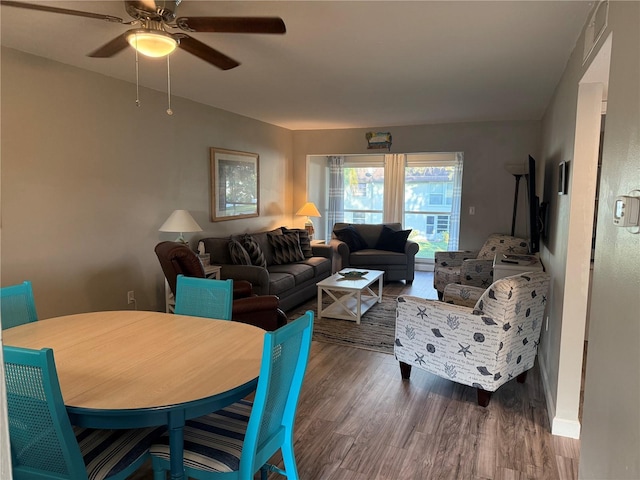 living room with hardwood / wood-style flooring and ceiling fan