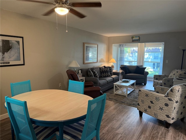 living room with hardwood / wood-style flooring and ceiling fan