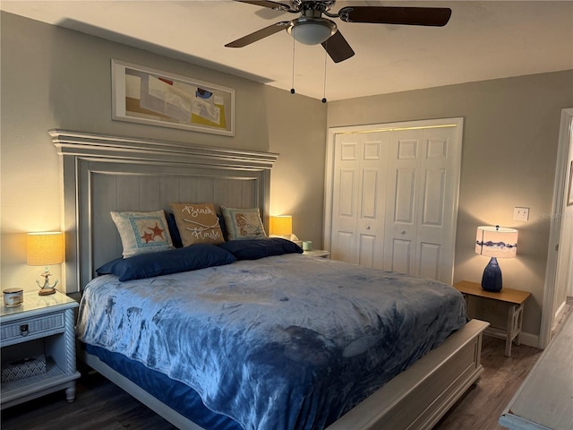 bedroom featuring a closet, dark wood-type flooring, and ceiling fan