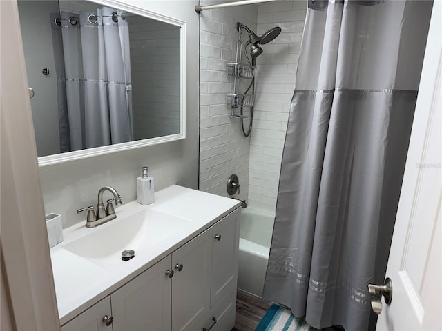 bathroom with vanity, shower / tub combo, and hardwood / wood-style floors