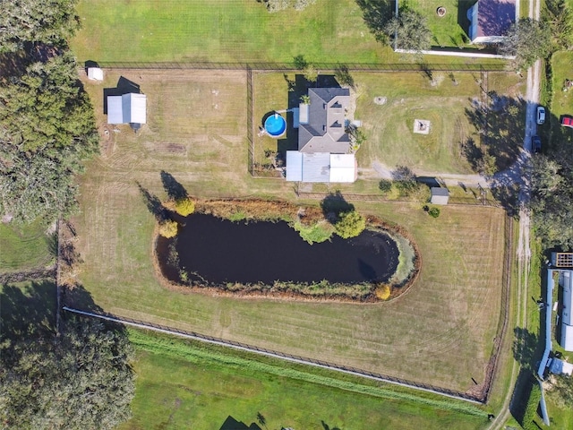 birds eye view of property with a rural view and a water view