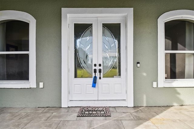 property entrance featuring french doors