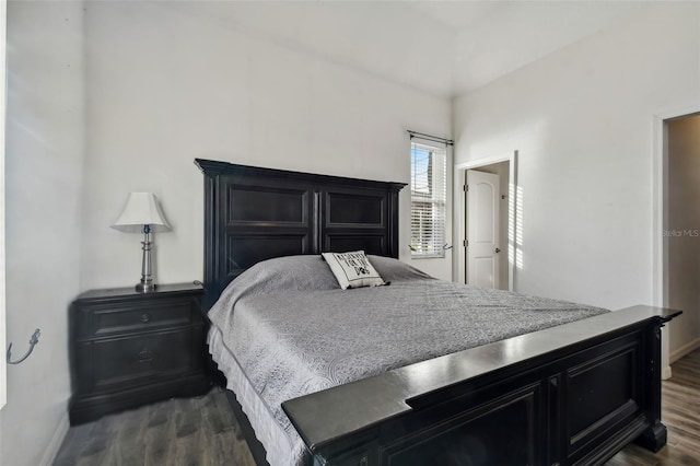 bedroom featuring dark hardwood / wood-style flooring