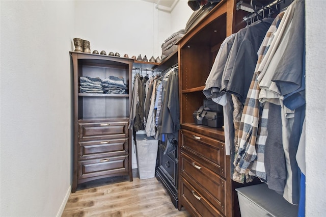 walk in closet featuring light wood-type flooring