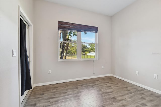 unfurnished room featuring wood-type flooring