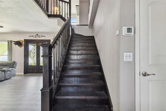 stairway with hardwood / wood-style floors