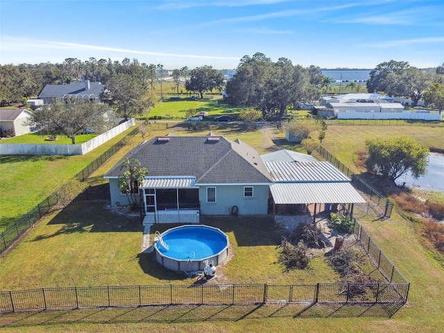 view of swimming pool with a yard