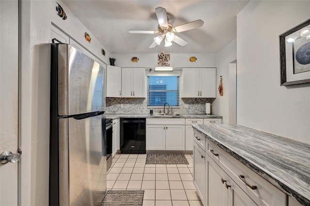 kitchen with white cabinetry, backsplash, black appliances, and sink