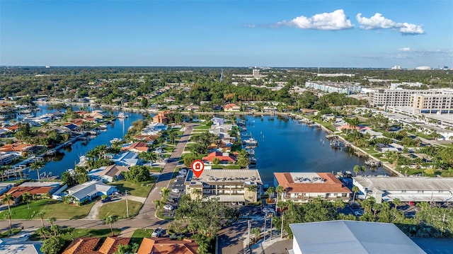 drone / aerial view with a residential view and a water view