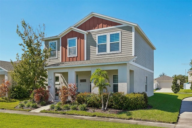 view of front of home featuring a front yard and a garage