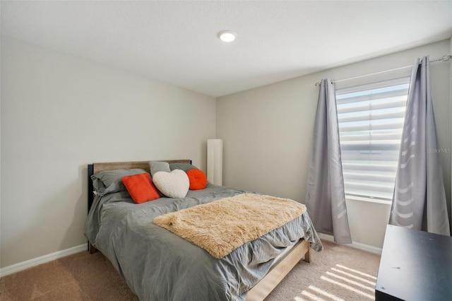 bedroom featuring light colored carpet