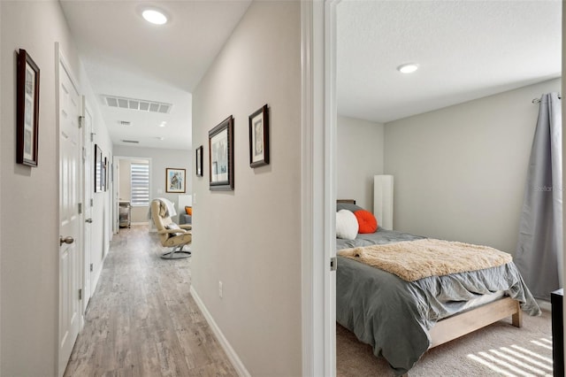 hallway with light wood-type flooring