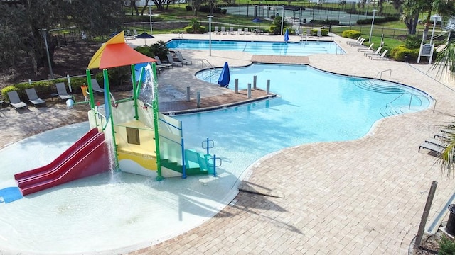 view of pool featuring a patio