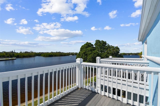 wooden terrace with a water view