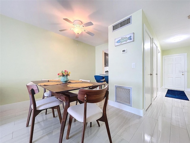 dining area with ceiling fan