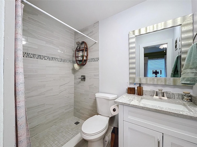 bathroom with vanity, toilet, and a shower with shower curtain