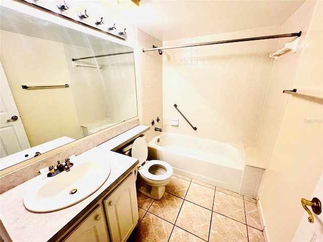 full bathroom featuring toilet, tiled shower / bath, tile patterned floors, and vanity