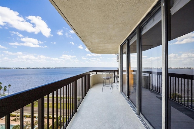 balcony featuring a water view