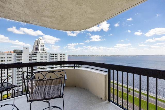 balcony featuring a water view