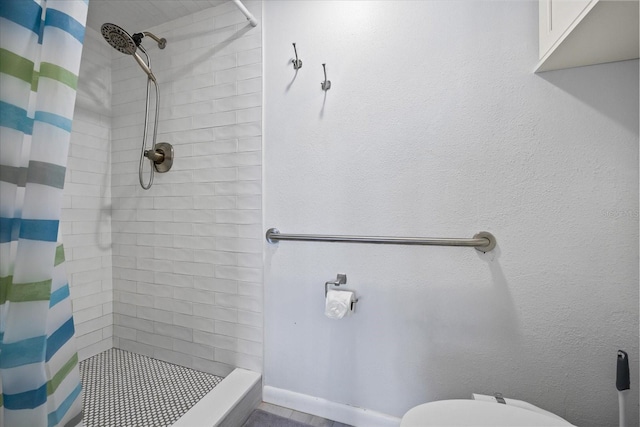 bathroom with toilet and walk in shower