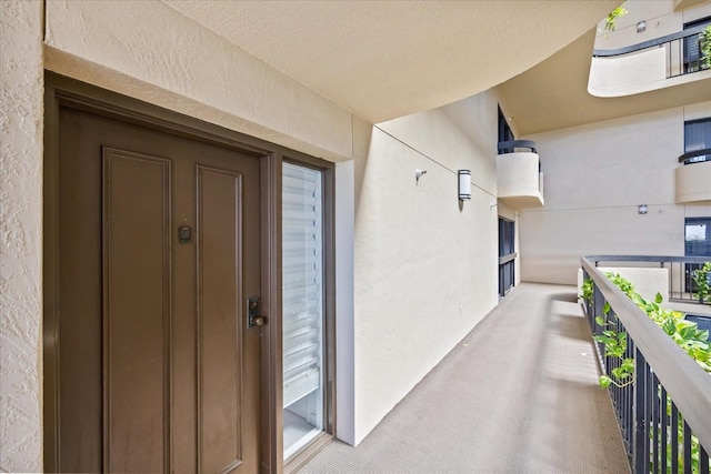 entrance to property featuring a balcony