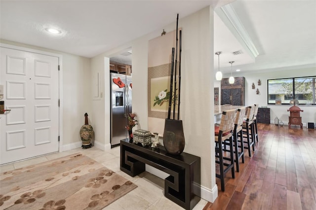 foyer entrance with light wood-type flooring