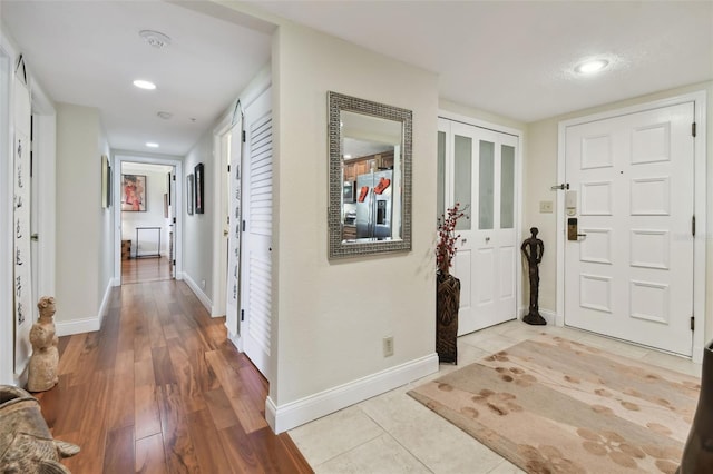 entrance foyer with light wood-type flooring