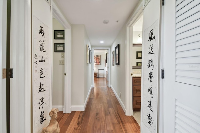 corridor featuring wood-type flooring