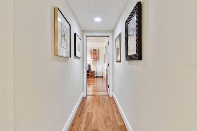 corridor with light wood-type flooring