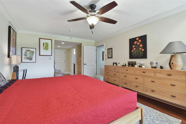 bedroom with ornamental molding, dark hardwood / wood-style floors, and ceiling fan