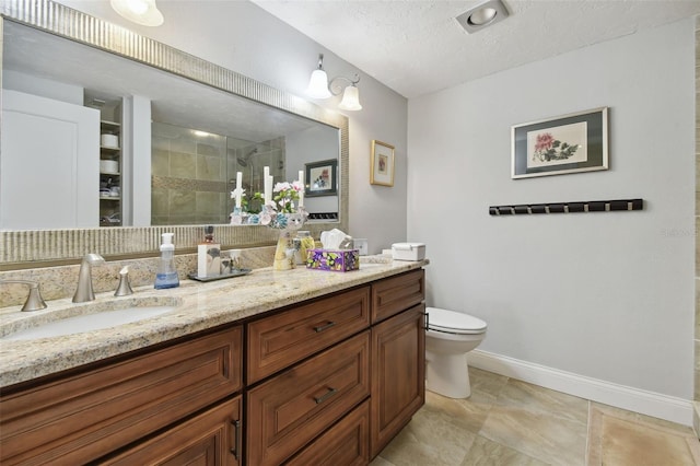 bathroom with vanity, a textured ceiling, toilet, and an enclosed shower