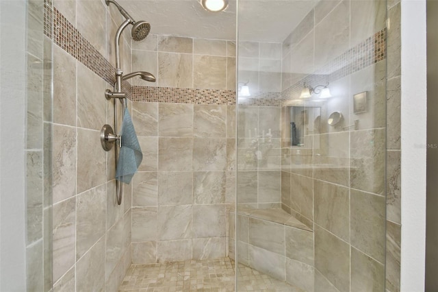 bathroom with tiled shower