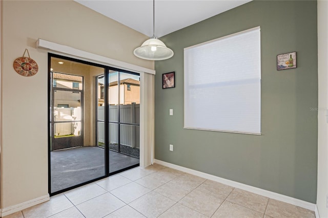 empty room featuring light tile patterned floors