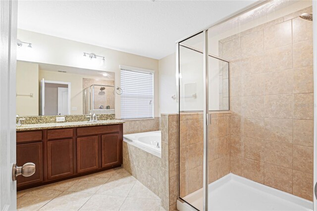 bathroom featuring vanity, tile patterned floors, and plus walk in shower