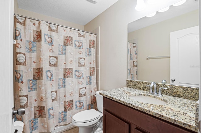 bathroom with toilet, a textured ceiling, vanity, and a shower with shower curtain